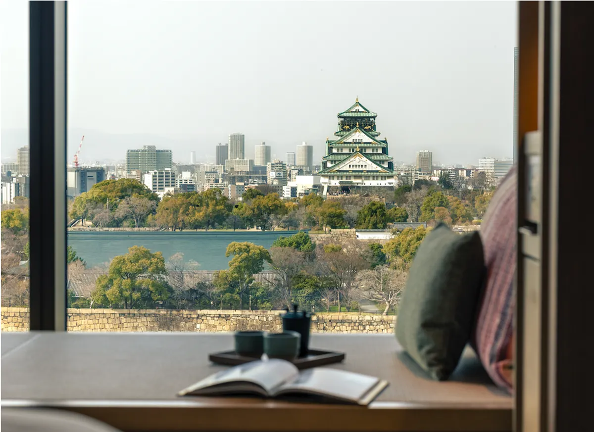 Osaka Castle seen across its moat from a window seat, Osaka, Japan